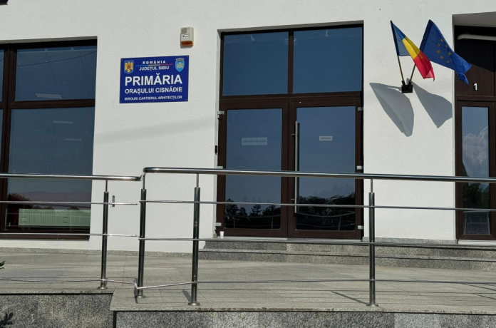 primăria Cisnădie, noul sediu primărie, Cartierul Arhitecților, sediu administrativ Cisnădie, punct de lucru primărie, birouri primărie, taxe și impozite Cisnădie, casierie primărie, asistență socială Cisnădie, registratură primărie, servicii publice Cisnădie, program primărie, orar primărie Cisnădie, birouri administrative, spații primărie, chirie sediu primărie, contract închiriere primărie, cost chirie primărie, transparență administrație, investiții publice, administrație locală, acces servicii primărie, descentralizare servicii, modernizare administrație, dezvoltare locală Cisnădie, proiect primărie, inaugurare sediu, fosta locație Profi, strada Cantacuzino, punct administrativ, relații cu publicul, reducere timp așteptare, servicii aproape de cetățeni, colaborare ONG, sală de întâlniri, spațiu comunitar, Cartierul Arhitecților Sibiu, locuitori Cisnădie, administrație eficientă, reducere trafic, reducere poluare, servicii locale, investiții Cisnădie, decizie consiliu local, vot consiliu local, sprijin partide, opoziție locală, serviciu taxe, serviciu impozite, birou impozite, birou taxe, serviciu registratură, birou registratură, birou casierie, birou asistență socială, beneficii comunitare, eficiență administrativă, economie locală, spațiu închiriat, serviciu public local, program extins primărie, orar marți joi, orar luni miercuri, orar vineri, primărie aproape, accesibilitate servicii, administrație transparentă, fonduri publice, costuri publice, utilizare fonduri publice, chirie lunară, chirie anuală, închiriere spațiu, sprijin comunitar, investiții în comunitate, facilități comunitare, spații moderne primărie, servicii rapide, program cetățeni, administrație deschisă, dialog cu cetățenii, birouri moderne, sediu secundar primărie, reducere aglomerație, reducere cozi primărie, Cartierul Arhitecților serviciu public, spații funcționale, îmbunătățire servicii, program birouri, servicii eficiente, servicii pentru cetățeni, noul punct administrativ, investiții în infrastructură, servicii locale eficiente, birou modern, comunitate Cisnădie, primar Mircea Orlățan.