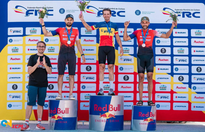 Cristian Jidovu, Cross Country Marathon, victorie, ciclist sibian, a 7-a victorie consecutivă, ciclism montan, MTB România, sport Sibiu, campion, anduranță, traseu montan, competiție sportivă, cicliști români, performanță sportivă, campion național, podium, maraton MTB, concurs ciclism, bicicletă montană, curse de anduranță, antrenamente ciclism, pregătire fizică, disciplină sportivă, Sibiu sport, comunitate sportivă, inspirație tineri, sportivi români, ciclism profesionist, maraton montan, campion imbatabil, tradiție sportivă, club sportiv Sibiu, echipă ciclism, sponsori sport, susținere comunitară, performanță românească, campion local, eveniment sportiv, public entuziast, competiție națională, cicliști internaționali, traseu dificil, rezistență fizică, rezistență psihică, depășire limite, mentalitate câștigătoare, campion de anduranță, victorie consecutivă, competiție MTB, ciclist profesionist, exemplu sportiv, regele Cross Country, bicicliști români, sport montan, cultură sportivă, record victorii, istorie MTB, sport extrem, pasiune pentru ciclism, perseverență, dedicare, pregătire intensă, maraton cicliști, participare masivă, competiție anuală, rivalitate sportivă, podium câștigători, spirit de competiție, energie public, workshop ciclism, tabere MTB, cluburi sportive, educație sportivă, promovare sport, festival sportiv, sănătate prin sport, motivație, sport outdoor, cicliști inspirați, maraton România, cicliști pasionați, elite sport, biciclete profesionale, trasee montane, tehnică ciclism, spirit sportiv, campion consecutiv, anduranță extremă, învingător, inspirație comunitate, performanță internațională, spirit competițional, câștigător, trofeu, ciclist legendă, exemplu pentru tineri, sport și sănătate, dedicare totală, campion Sibiu, victorie istorică.